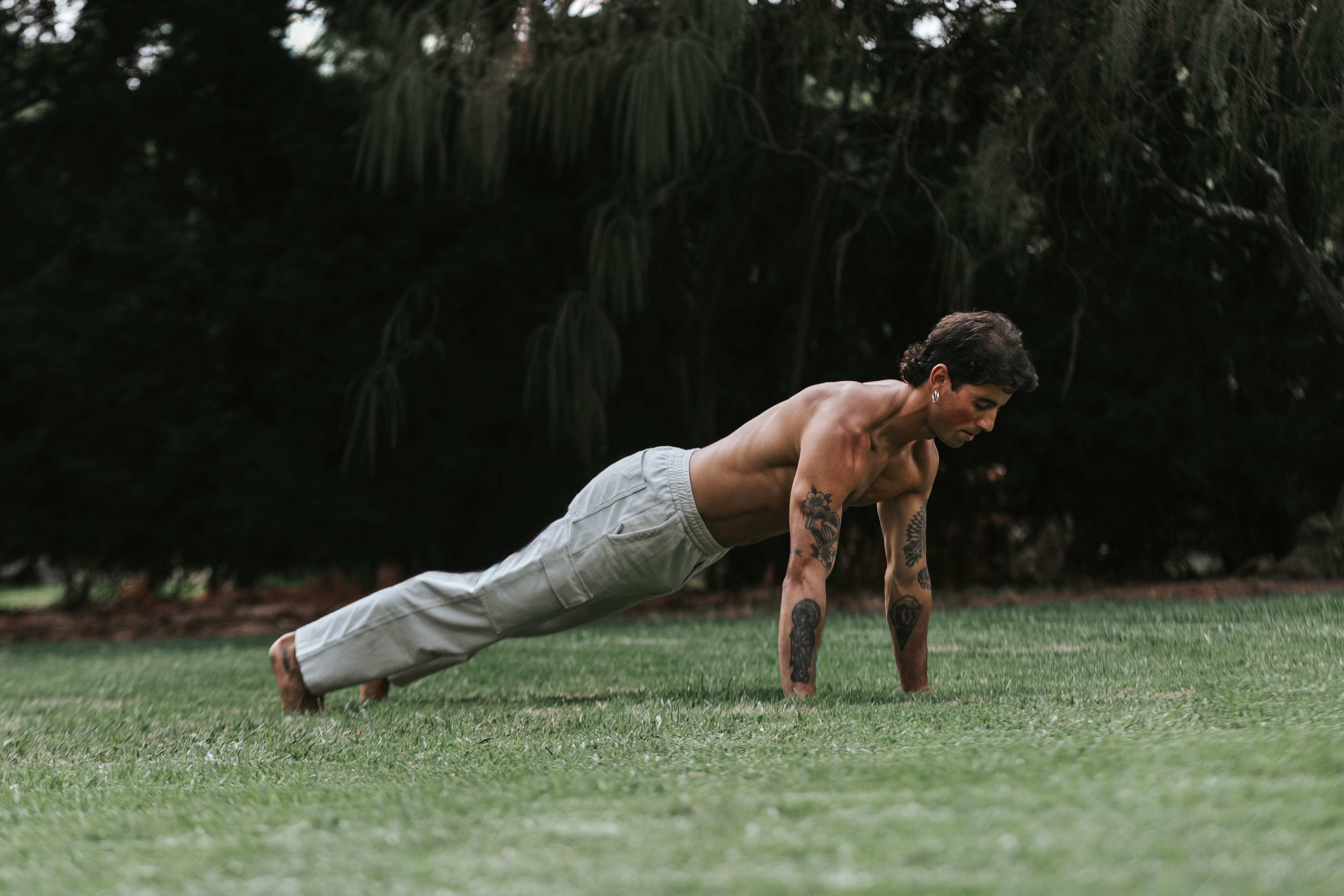 A guided movement session — push-up on the grass